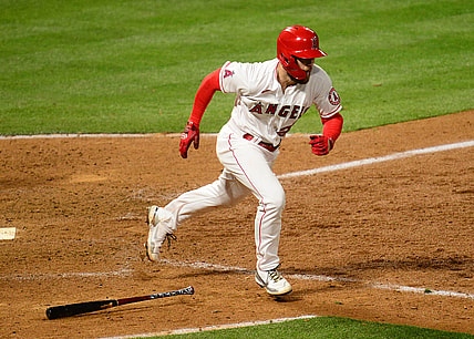 Apr 5, 2021; Anaheim, California, USA; Los Angeles Angels first baseman Jared Walsh (20) reaches first on a fielders choice against the Houston Astros during the eighth inning at Angel Stadium. Mandatory Credit: Gary A. Vasquez-USA TODAY Sports