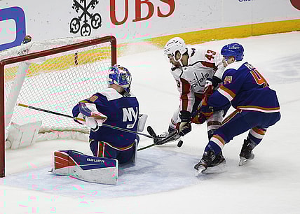 Apr 24, 2021; Uniondale, New York, USA; New York Islanders goaltender Ilya Sorokin (30) defends his net as center Jean-Gabriel Pageau (44) checks Washington Capitals right wing Tom Wilson (43) off the puck during the first at Nassau Veterans Memorial Coliseum. Mandatory Credit: Andy Marlin-USA TODAY Sports