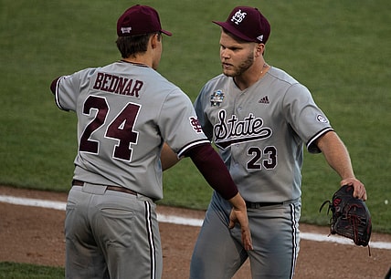 Mississippi St. pitcher Will Bednar (24) hugs relief pitcher Landon Sims (23) after Sims replaced Bednar in the seventh inning against Texas during game 4 in the NCAA Men   s College World Series at TD Ameritrade Park Sunday, June 20, 2021 in Omaha, Neb.

Nas Miss St Texas 028