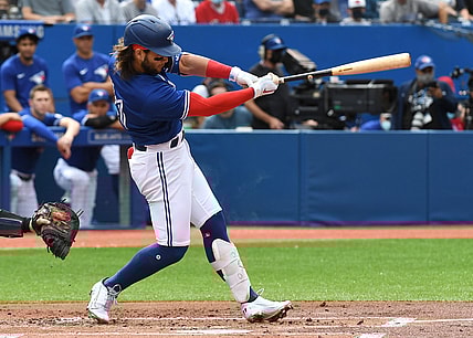 Sep 15, 2021; Toronto, Ontario, CAN;  Toronto Blue Jays shortstop Bo Bichette (11) hits a three run home run against Tampa Bay Rays in the first inning at Rogers Centre. Mandatory Credit: Dan Hamilton-USA TODAY Sports