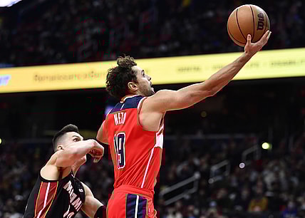 Nov 20, 2021; Washington, District of Columbia, USA; Washington Wizards guard Raul Neto (19) shoots the ball against Miami Heat guard Tyler Herro (14) during the second half at Capital One Arena. Mandatory Credit: Brad Mills-USA TODAY Sports