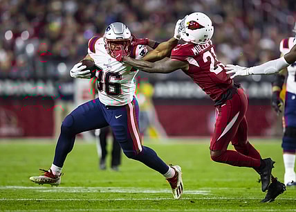 Dec 12, 2022; Glendale, Arizona, USA; New England Patriots running back Kevin Harris (36) is face masked by Arizona Cardinals cornerback Trayvon Mullen (21) in the first half at State Farm Stadium. Mandatory Credit: Mark J. Rebilas-USA TODAY Sports