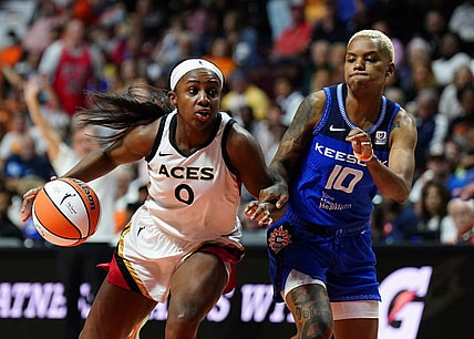 Sep 15, 2022; Uncasville, Connecticut, USA; Las Vegas Aces guard Jackie Young (0) drives the ball against Connecticut Sun guard Courtney Williams (10) in the second half during game three of the 2022 WNBA Finals at Mohegan Sun Arena. Mandatory Credit: David Butler II-USA TODAY Sports