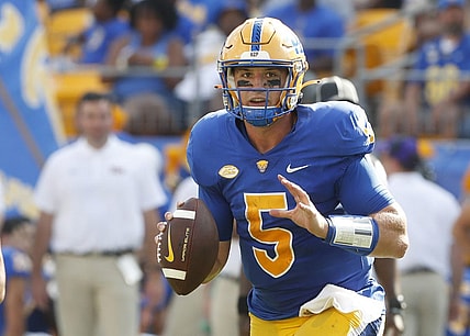 Sep 2, 2023; Pittsburgh, Pennsylvania, USA; Pittsburgh Panthers quarterback Phil Jurkovec (5) scrambles with the ball against the Wofford Terriers during the second quarter at Acrisure Stadium. Mandatory Credit: Charles LeClaire-USA TODAY Sports