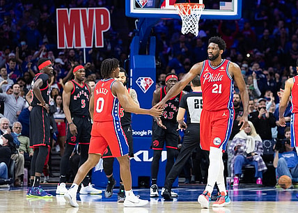 Apr 18, 2022; Philadelphia, Pennsylvania, USA; Philadelphia 76ers center Joel Embiid (21) reacts with guard Tyrese Maxey (0) after a score and one against the Toronto Raptors during the first quarter in game two of the first round for the 2022 NBA playoffs at Wells Fargo Center. Mandatory Credit: Bill Streicher-USA TODAY Sports