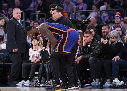Jan 27, 2024; New York, New York, USA; New York Knicks forward Julius Randle (30) is helped by medical staff after an injury during the second half against the Miami Heat at Madison Square Garden. Mandatory Credit: Vincent Carchietta-USA TODAY Sports