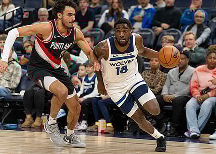 Jan 12, 2024; Minneapolis, Minnesota, USA; Minnesota Timberwolves guard Shake Milton (18) is defended by Portland Trail Blazers forward Justin Minaya (24) in the fourth quarter at Target Center. Mandatory Credit: Matt Blewett-USA TODAY Sports