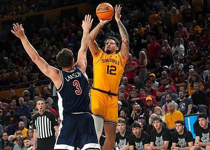 ASU Sun Devils guard Jose Perez (12) shoots the ball over UA Wildcats guard Pelle Larsson (3) at Desert Financial Arena in Tempe on Feb. 28, 2024.