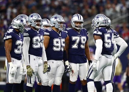 Dallas Cowboys huddle during game