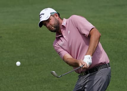 Apr 8, 2021; Augusta, Georgia, USA; Marc Leishman chips onto the 2nd green during the first round of The Masters golf tournament. Mandatory Credit: Michael Madrid-USA TODAY Sports