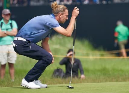 Jul 16, 2021; Sandwich, England, GB; Marcel Siem lines up a putt on the fifth green during the second  round of the Open Championship golf tournament. Mandatory Credit: Peter van den Berg-USA TODAY Sports