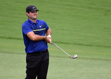 Aug 14, 2020; Greensboro, North Carolina, USA; Patrick Reed watches his approach shot on the ninth hole during the second round of the Wyndham Championship golf tournament at Sedgefield Country Club. Mandatory Credit: Rob Kinnan-USA TODAY Sports