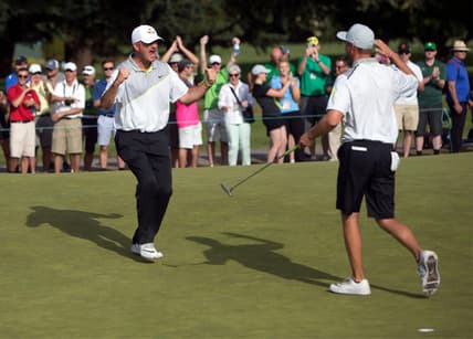 Oregon head coach Casey Martin celebrates with golfer  Sulman Raza after Raza made the match winning putt in his semifinal match against Illinois' Charlie Danielson to send the Ducks into the finals of the NCAA men's golf championship at Eugene Country Club in Eugene in 2016. [Andy Nelson/The Register-Guard] - registerguard.com

4he6klekv3h0a5c7xhglzbhb7vy