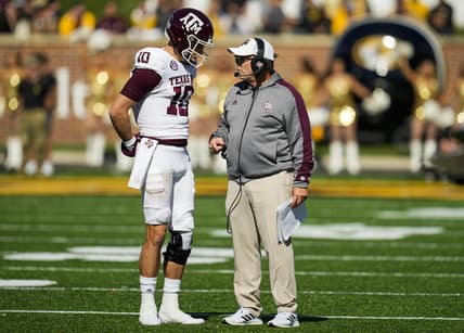 Oct 16, 2021; Columbia, Missouri, USA; Texas A&M Aggies quarterback Zach Calzada (10) talks with head coach Jimbo Fisher during the second half against the Missouri Tigers at Faurot Field at Memorial Stadium. Mandatory Credit: Jay Biggerstaff-USA TODAY Sports
