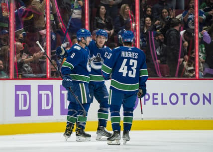 Nov 7, 2021; Vancouver, British Columbia, CAN; Vancouver Canucks forward J.T. Miller (9) and forward Bo Horvat (53) and defenseman Quinn Hughes (43) celebrate Miller   s goal against the Dallas Stars in the second period at Rogers Arena. Mandatory Credit: Bob Frid-USA TODAY Sports