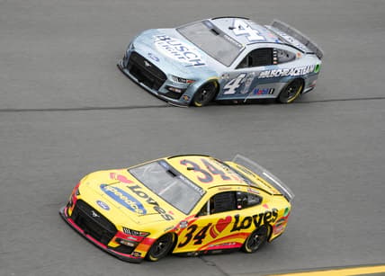 Feb 15, 2022; Daytona, FL, USA; NASCAR Cup Series driver Michael McDowell (34) and driver Kevin Harvick (4) during practice for the Daytona 500 at Daytona International Speedway. Mandatory Credit: Mike Dinovo-USA TODAY Sports
