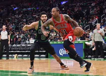 Jan 15, 2022; Boston, Massachusetts, USA; Chicago Bulls forward DeMar DeRozan (11) controls the ball while Boston Celtics forward Jayson Tatum (0) defends during the second half at TD Garden. Mandatory Credit: Bob DeChiara-USA TODAY Sports