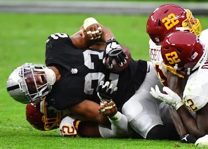 Dec 5, 2021; Paradise, Nevada, USA;Las Vegas Raiders running back Kenyan Drake (23) sustains an injury during a play against the Washington Football Team at Allegiant Stadium. Mandatory Credit: Stephen R. Sylvanie-USA TODAY Sports