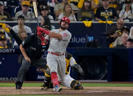 Oct 18, 2022; San Diego, California, USA; Philadelphia Phillies left fielder Kyle Schwarber (12) hits a home run during the sixth inning of game one of the NLCS for the 2022 MLB Playoffs against the San Diego Padres at Petco Park. Mandatory Credit: Jayne Kamin-Oncea-USA TODAY Sports