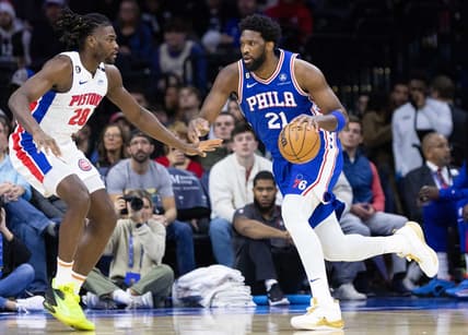 Dec 21, 2022; Philadelphia, Pennsylvania, USA; Philadelphia 76ers center Joel Embiid (21) drives against Detroit Pistons center Isaiah Stewart (28) during the first quarter at Wells Fargo Center. Mandatory Credit: Bill Streicher-USA TODAY Sports