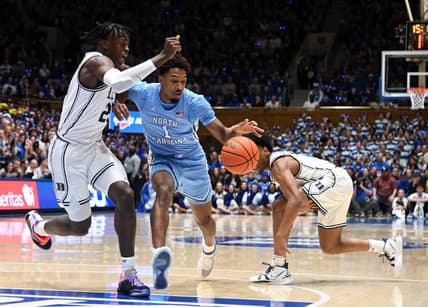 Feb 4, 2023; Durham, North Carolina, USA; North Carolina Tar Heels guard Leaky Black (1) drives to the basket as Duke Blue Devils forward Mark Mitchell (25) defends during the first half at Cameron Indoor Stadium. Mandatory Credit: Rob Kinnan-USA TODAY Sports