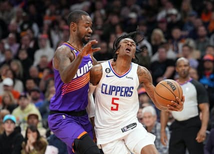 Feb 16, 2023; Phoenix, Arizona, USA; Phoenix Suns guard Terrence Ross (8) fouls LA Clippers guard Bones Hyland (5) during the second half at Footprint Center. Mandatory Credit: Joe Camporeale-USA TODAY Sports