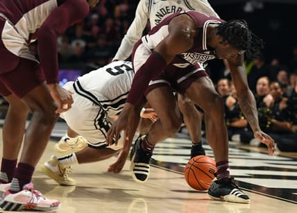 Mar 4, 2023; Nashville, Tennessee, USA; Mississippi State Bulldogs guard Cameron Matthews (4) loses the ball to Vanderbilt Commodores guard Ezra Manjon (5) during the first half at Memorial Gymnasium. Mandatory Credit: Christopher Hanewinckel-USA TODAY Sports