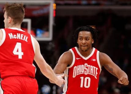 Ohio State Buckeyes guard Sean McNeil (4) high-fives Ohio State Buckeyes forward Brice Sensabaugh (10) during the Big Ten Men   s Basketball Tournament game against the Iowa Hawkeyes, Thursday, March 9, 2023, at United Center in Chicago. Ohio State Buckeyes won 73-69.

Osuiowa030923 Am11305
