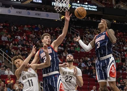 Mar 17, 2023; Houston, Texas, USA; Houston Rockets center Alperen Sengun (28) and guard Kevin Porter Jr. (3) try to grab a rebound against New Orleans Pelicans forward Larry Nance Jr. (22) and guard Dyson Daniels (11)  in the first quarter at Toyota Center. Mandatory Credit: Thomas Shea-USA TODAY Sports