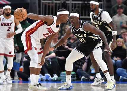 Apr 16, 2023; Milwaukee, Wisconsin, USA; Miami Heat forward Jimmy Butler (22) against Milwaukee Bucks forward Khris Middleton (22) in the second half during game one of the 2023 NBA Playoffs at Fiserv Forum. Mandatory Credit: Michael McLoone-USA TODAY Sports