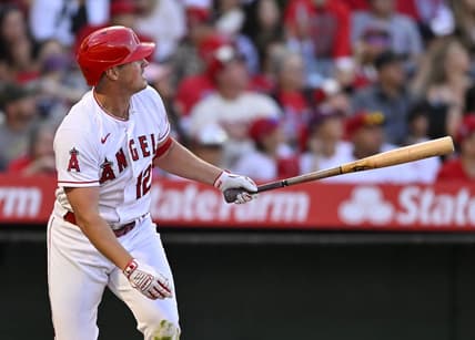 Apr 22, 2023; Anaheim, California, USA;  Los Angeles Angels right fielder Hunter Renfroe (12) hits a solo home run in the fourth inning against the Kansas City Royals at Angel Stadium. Mandatory Credit: Jayne Kamin-Oncea-USA TODAY Sports