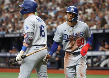 May 27, 2023; St. Petersburg, Florida, USA;  Los Angeles Dodgers right fielder Mookie Betts (50) is congratulated after he scored during the fifth inning against the Tampa Bay Rays at Tropicana Field. Mandatory Credit: Kim Klement-USA TODAY Sports