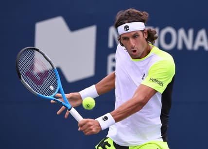 Aug 8, 2021; Toronto, Ontario, Canada;  Feliciano Lopez of Spain plays a shot against Yoshihito Nishioka of Japan during second round qualifying for the National Bank Open. Mandatory Credit: Dan Hamilton-USA TODAY Sports
