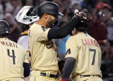 Jul 7, 2023; Phoenix, AZ, USA; Arizona Diamondbacks' Lourdes Gurriel Jr. (12) celebrates his 3-run home run with teammate Corbin Carroll (7) against the Pittsburgh Pirates at Chase Field.