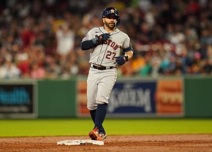 Aug 28, 2023; Boston, Massachusetts, USA; Houston Astros second baseman Jose Altuve (27) hits a double against the Boston Red Sox in the third inning at Fenway Park. Mandatory Credit: David Butler II-USA TODAY Sports