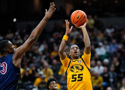 Nov 22, 2023; Columbia, Missouri, USA; Missouri Tigers guard Sean East II (55) shoots against South Carolina State Bulldogs center Drayton Jones (13) during the second half at Mizzou Arena. Mandatory Credit: Jay Biggerstaff-USA TODAY Sports