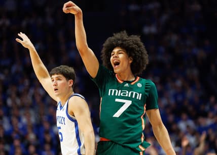 Nov 28, 2023; Lexington, Kentucky, USA; Miami (Fl) Hurricanes guard Kyshawn George (7) reacts after making a basket during the first half against the Kentucky Wildcats at Rupp Arena at Central Bank Center. Mandatory Credit: Jordan Prather-USA TODAY Sports