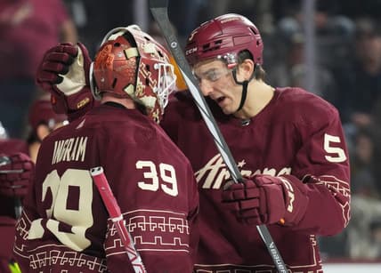 Jan 20, 2024; Tempe, Arizona, USA; Arizona Coyotes goaltender Connor Ingram (39) and Arizona Coyotes defenseman Michael Kesselring (5) celebrate after defeating the Nashville Predators during at Mullett Arena. Mandatory Credit: Joe Camporeale-USA TODAY Sports