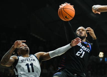 Jan 20, 2024; Indianapolis, Indiana, USA;  Butler Bulldogs guard Jahmyl Telfort (11) and DePaul Blue Demons forward Da'Sean Nelson (21) battle for a rebound during the second half at Hinkle Fieldhouse. Mandatory Credit: Robert Goddin-USA TODAY Sports