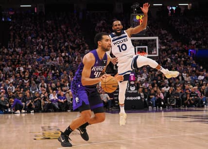 Dec 23, 2023; Sacramento, California, USA; Sacramento Kings forward Trey Lyles (41) controls the ball against Minnesota Timberwolves guard Mike Conley (10) during the fourth quarter at Golden 1 Center. Mandatory Credit: Kelley L Cox-USA TODAY Sports
