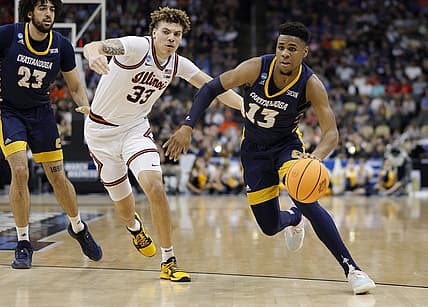 Mar 18, 2022; Pittsburgh, PA, USA; Chattanooga Mocs guard Malachi Smith (13) drives past Illinois Fighting Illini forward Coleman Hawkins (33) in the first half during the first round of the 2022 NCAA Tournament at PPG Paints Arena. Mandatory Credit: Geoff Burke-USA TODAY Sports