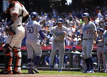 Aug 4, 2022; San Francisco, California, USA; Los Angeles Dodgers right fielder Mookie Betts (50) is greeted by teammates Gavin Lux (9) and James Outman (77) after hitting a three-run home run against the San Francisco Giants during the fourth inning at Oracle Park. Mandatory Credit: D. Ross Cameron-USA TODAY Sports