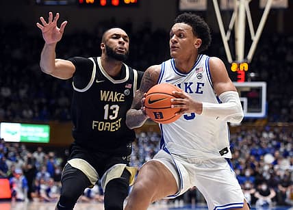 Feb 15, 2022; Durham, North Carolina, USA; Duke Blue Devils forward Paolo Banchero (5) moves to the basket as Wake Forest Demon Deacons forward Dallas Walton (13) defends during the second half at Cameron Indoor Stadium.  The Blue Devils won 76-74. Mandatory Credit: Rob Kinnan-USA TODAY Sports