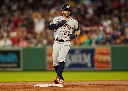 Aug 28, 2023; Boston, Massachusetts, USA; Houston Astros second baseman Jose Altuve (27) hits a double against the Boston Red Sox in the third inning at Fenway Park. Mandatory Credit: David Butler II-USA TODAY Sports
