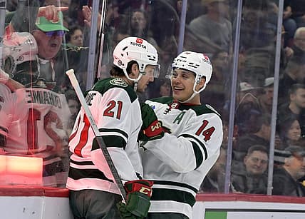 Oct 17, 2023; Montreal, Quebec, CAN; Minnesota Wild forward Brandon Duhaime (21) celebrates with teammate forward Joel Eriksson Ek (14) after scoring a goal against the Montreal Canadiens during the first period at the Bell Centre. Mandatory Credit: Eric Bolte-USA TODAY Sports