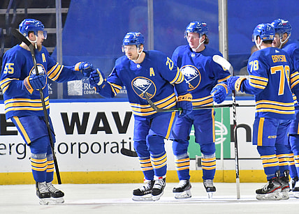 Mar 31, 2021; Buffalo, New York, USA; Buffalo Sabres defenseman Rasmus Ristolainen (55) congratulates center Sam Reinhart (23) after scoring a goal during the first period against the Philadelphia Flyers at KeyBank Center. Mandatory Credit: Mark Konezny-USA TODAY Sports
