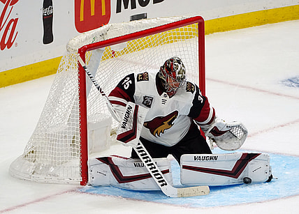 Apr 24, 2021; Los Angeles, California, USA; Arizona Coyotes goaltender Darcy Kuemper (35) blocks a shot against the Los Angeles Kings during the third period at Staples Center. Mandatory Credit: Gary A. Vasquez-USA TODAY Sports