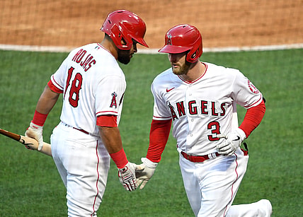 May 7, 2021; Anaheim, California, USA; Los Angeles Angels right fielder Taylor Ward (3) is greeted by third baseman Jose Rojas (18) after hitting a solo home run during the second inning against the Los Angeles Dodgers at Angel Stadium. Mandatory Credit: Jayne Kamin-Oncea-USA TODAY Sports