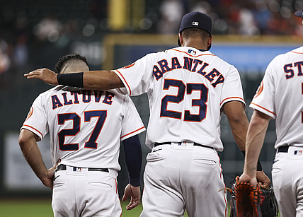 Jun 15, 2021; Houston, Texas, USA; Houston Astros left fielder Michael Brantley (23) talks with second baseman Jose Altuve (27) after a play during the third inning against the Texas Rangers at Minute Maid Park. Mandatory Credit: Troy Taormina-USA TODAY Sports