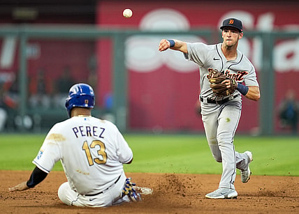 Jul 23, 2021; Kansas City, Missouri, USA; Detroit Tigers shortstop Zack Short (59) throws to first base after forcing out Kansas City Royals catcher Salvador Perez (13) during the fourth inning at Kauffman Stadium. Mandatory Credit: Jay Biggerstaff-USA TODAY Sports